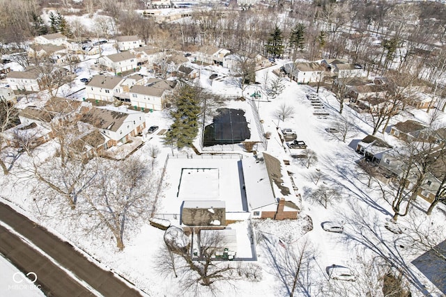 snowy aerial view with a residential view