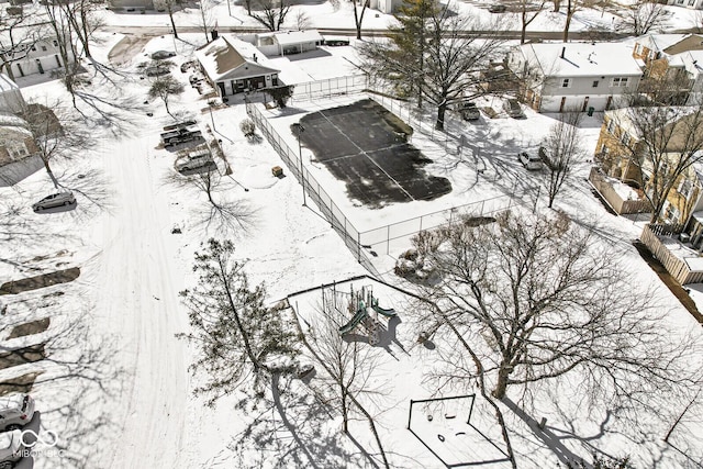 snowy aerial view featuring a residential view