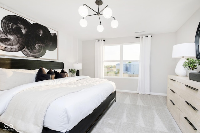 bedroom with light carpet and a notable chandelier