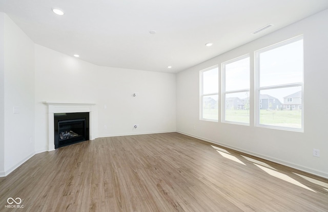 unfurnished living room with light wood-type flooring