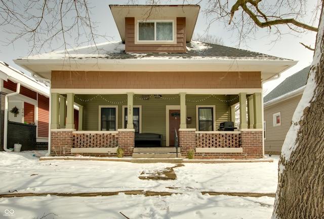 view of snow covered property entrance