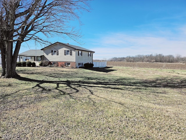 view of home's exterior with a lawn