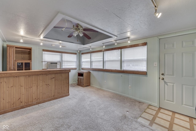 kitchen featuring a textured ceiling, cooling unit, ceiling fan, and track lighting