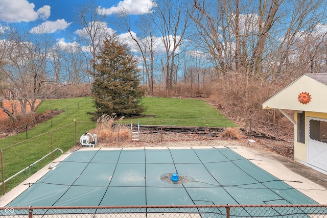 view of pool featuring a lawn