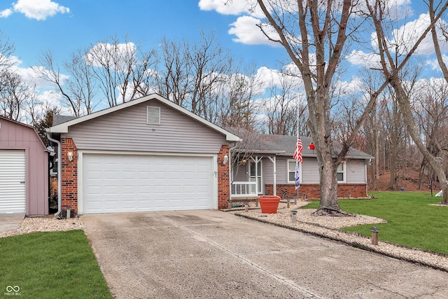 ranch-style home featuring a front lawn and a garage