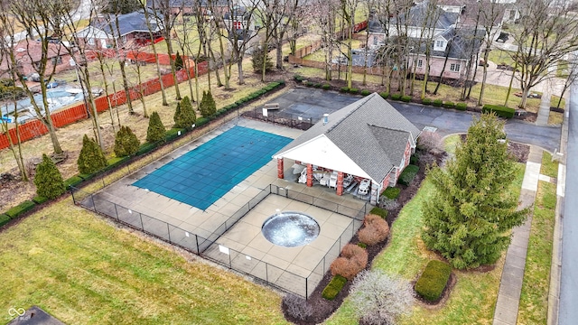 view of swimming pool with fence, a gazebo, a lawn, a residential view, and a patio area