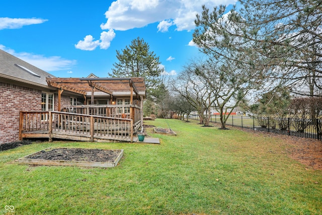 view of yard featuring fence, a wooden deck, and a pergola