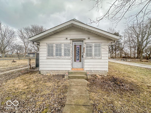 bungalow with a front lawn