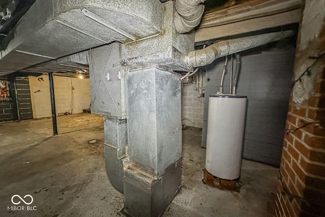 utility room with heating unit and water heater