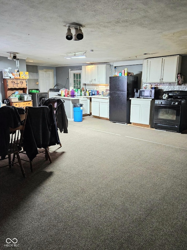 314 E Barachel Ln, Greensburg, IN 47240 - kitchen with white cabinets, light colored carpet, light countertops, a textured ceiling, and black appliances