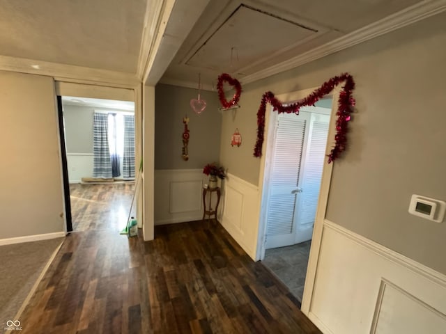 314 E Barachel Ln, Greensburg, IN 47240 - hall featuring dark wood-style floors, a wainscoted wall, a decorative wall, attic access, and ornamental molding