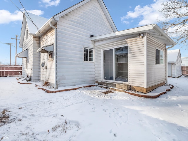 view of snow covered house