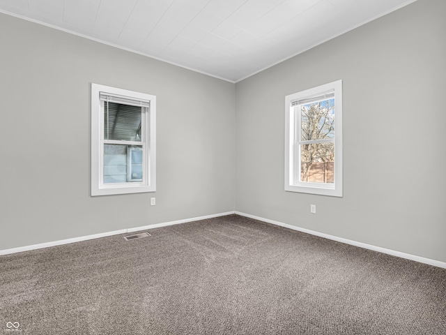 unfurnished room featuring carpet floors and ornamental molding