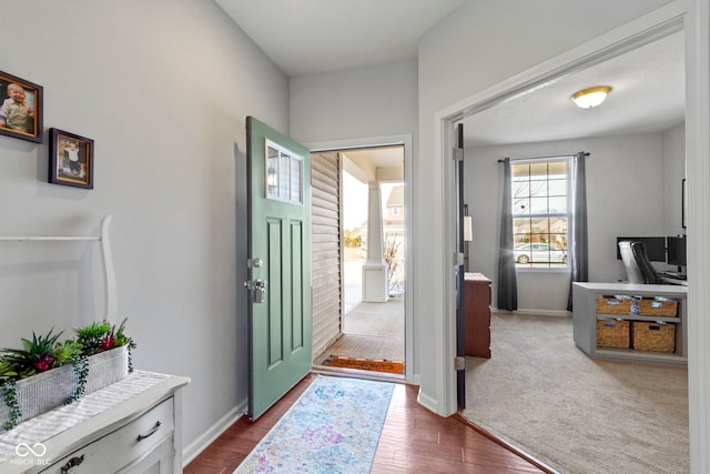 entryway featuring wood finished floors and baseboards