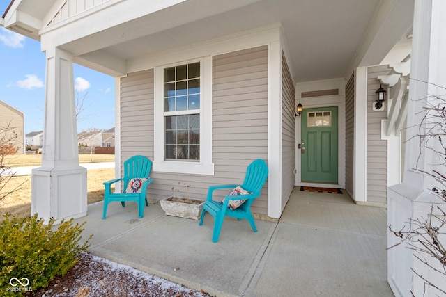 property entrance featuring board and batten siding and covered porch