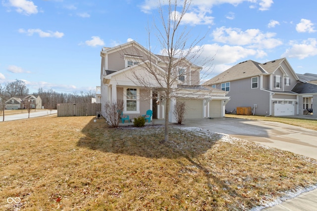 traditional-style home featuring concrete driveway and fence