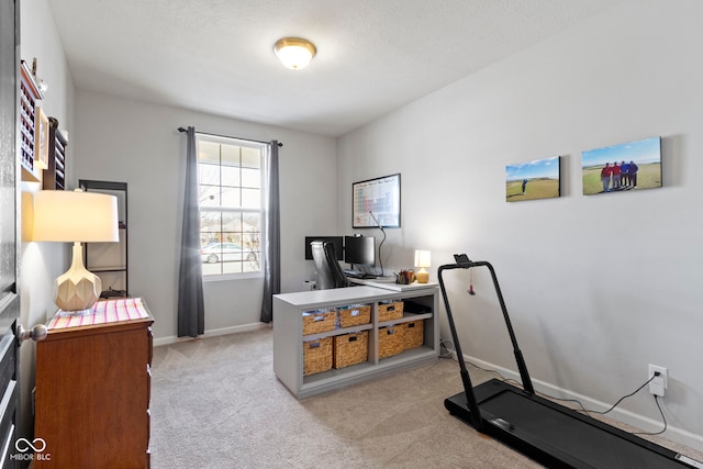 home office featuring light colored carpet and baseboards