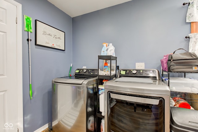 laundry area featuring washing machine and clothes dryer