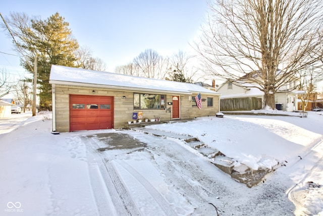 single story home featuring a garage