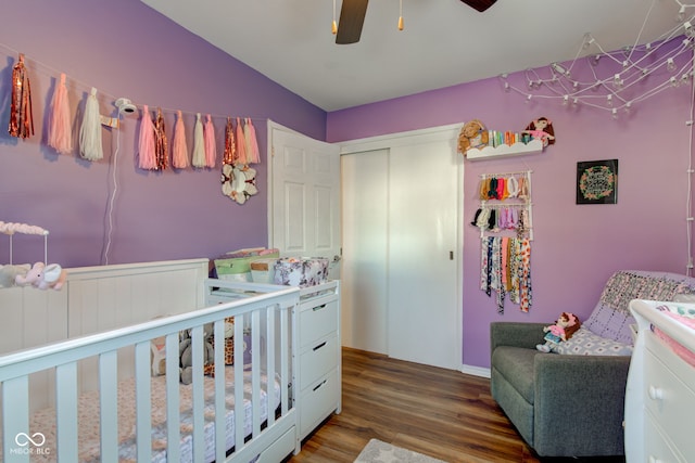 bedroom with ceiling fan, a closet, lofted ceiling, and dark hardwood / wood-style flooring