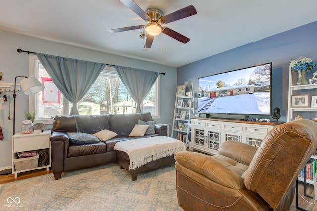 living room featuring hardwood / wood-style flooring and ceiling fan