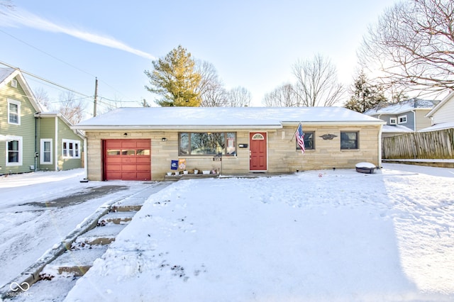 ranch-style house featuring a garage