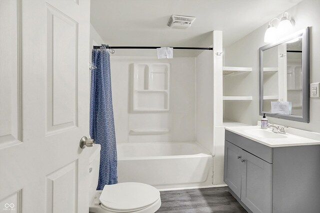 952 N Concord St, Indianapolis, IN 46222 - bathroom featuring vanity, wood finished floors, and shower / bath combo with shower curtain