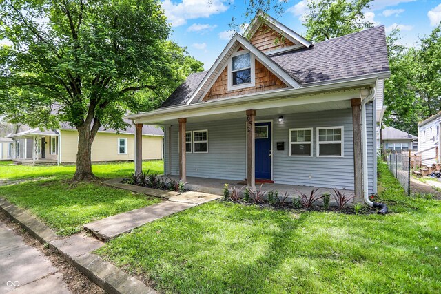 952 N Concord St, Indianapolis, IN 46222 - bungalow-style house with roof with shingles and covered porch
