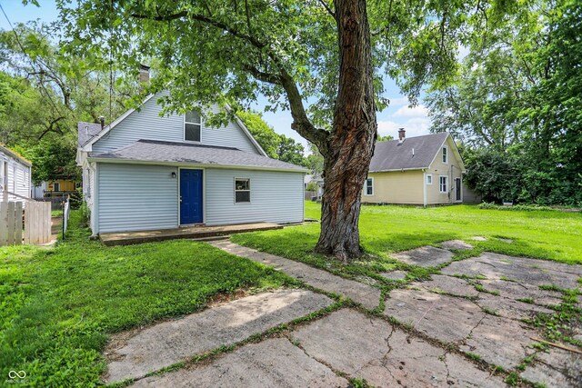 952 N Concord St, Indianapolis, IN 46222 - rear view of house featuring a chimney