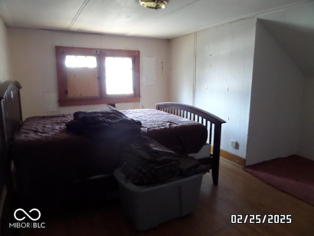 bedroom with wood finished floors