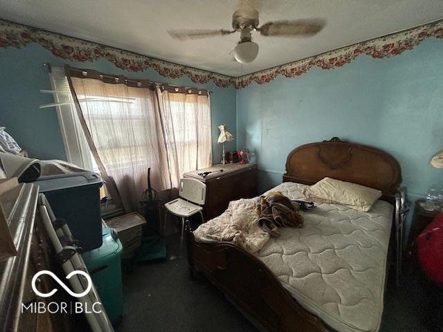 bedroom featuring carpet flooring and ceiling fan