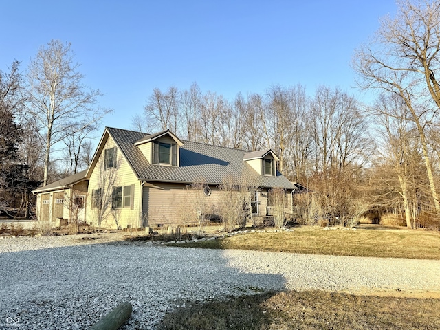 view of property exterior featuring metal roof