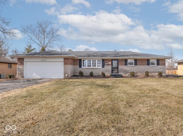 ranch-style house featuring a garage and a front yard