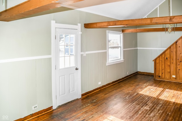 interior space with vaulted ceiling with beams, a wealth of natural light, and dark hardwood / wood-style floors