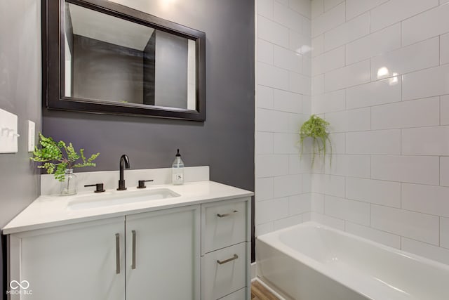 full bath with vanity and a washtub