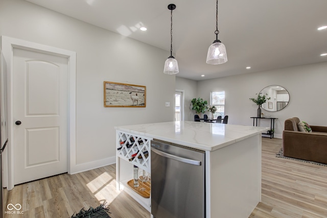 kitchen featuring light wood finished floors, light stone counters, decorative light fixtures, stainless steel dishwasher, and recessed lighting