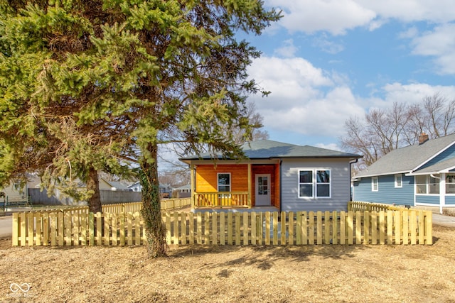 bungalow with a fenced front yard