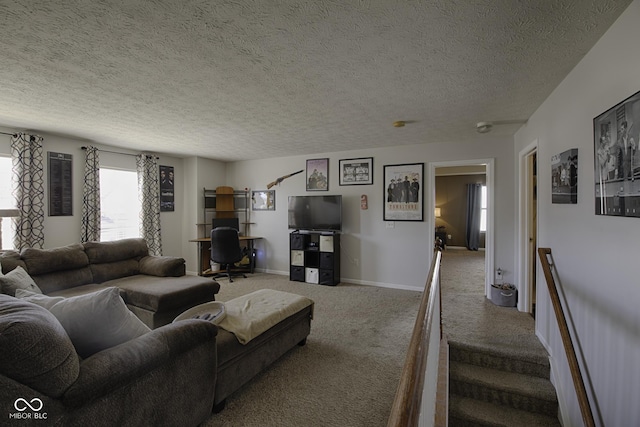 living room featuring carpet flooring and a textured ceiling