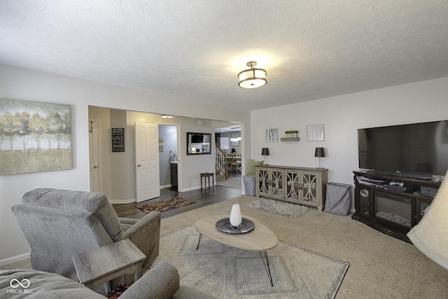 living room with a textured ceiling