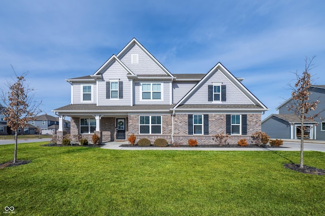 craftsman inspired home featuring a front lawn