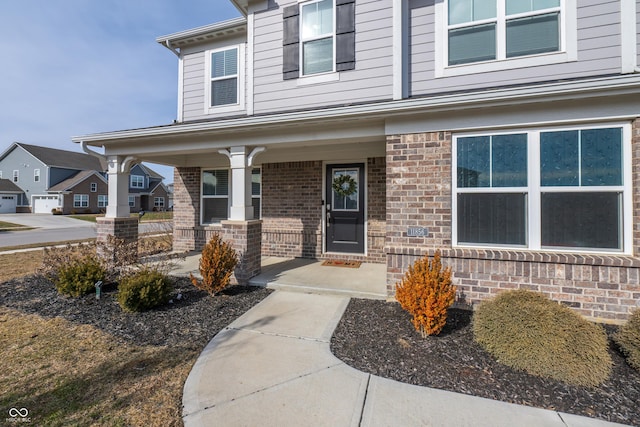 property entrance with covered porch