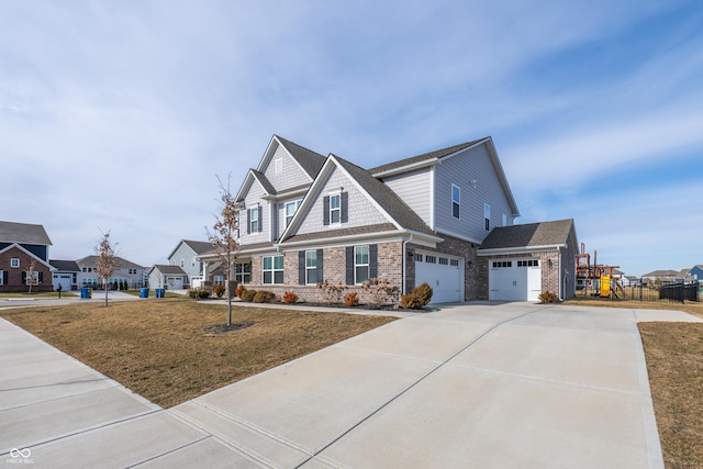 craftsman-style house with a garage and a front lawn