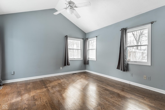 unfurnished room featuring ceiling fan, lofted ceiling, dark hardwood / wood-style floors, and plenty of natural light