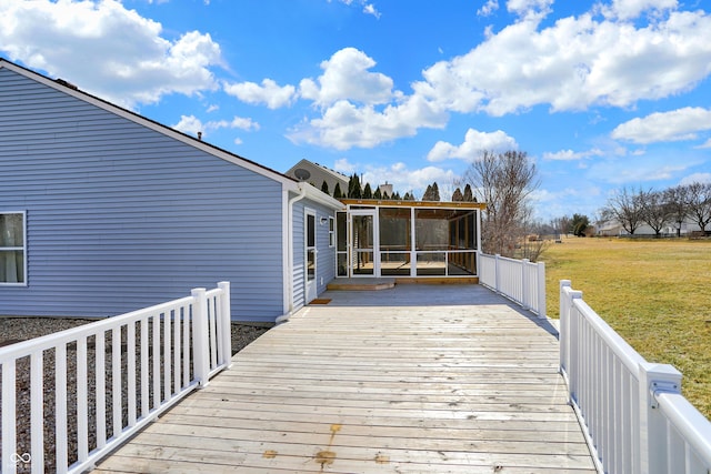 deck with a yard and a sunroom