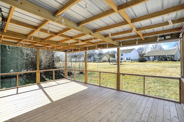 unfurnished sunroom featuring a residential view