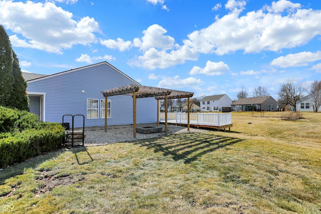 view of yard featuring a deck and a pergola