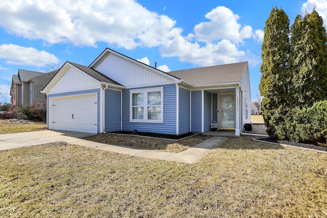 ranch-style house with a garage, concrete driveway, and a front lawn