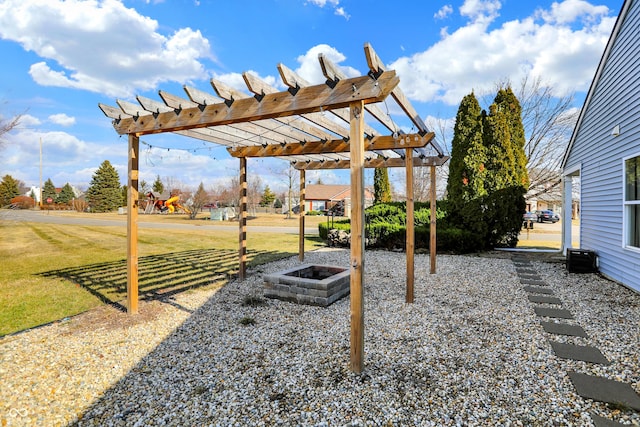 view of yard featuring a fire pit and a pergola