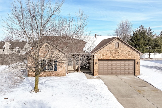 view of front of property with a garage, concrete driveway, and brick siding