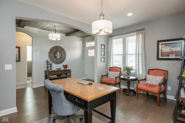 dining space featuring arched walkways, dark wood-style floors, beamed ceiling, and baseboards